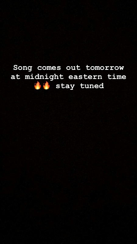 "song comes out tomorrow at midnight eastern time, stay tuned" written on a black background.